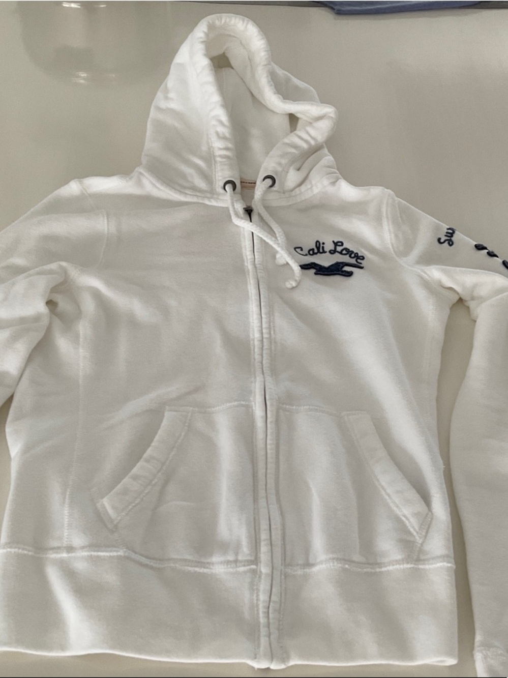 Hollister White Zip-Up Hoodie with Navy Embroidery